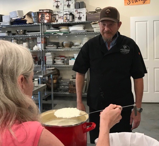 Instructor Ben Sessions of The Epicurean Connection keeps an eye on Denise’s cheesemaking progress.
